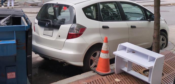 A Honda "Fit" (also known as "Jazz") subcompact car I parked on the street, with only a few centimeters/inches of clearance between the back bumper and a trash container, and zero clearance remaining between the front wheels and the sidewalk in front of them.

Ya can't park your Dodge RAM 1500 there, mate!