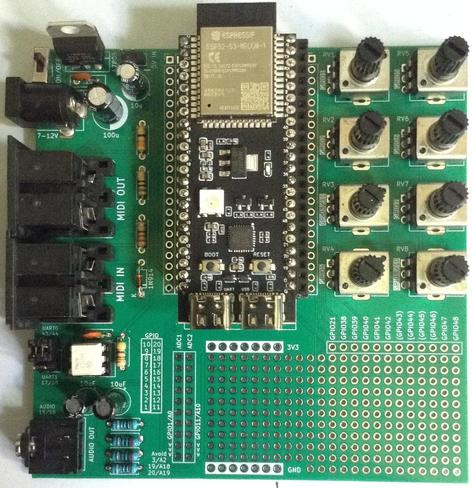 Photo of a custom, largely square, PCB with a long (twin 22-pin headers) dev board in the centre, power ,MIDI and PWM filter circuit off to the left, and 8 potentiometers off to the right.  There is also a prototyping area at the bottom.