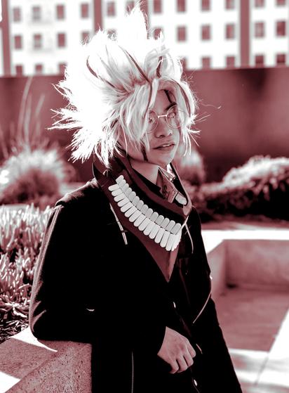 Young person wearing Dandadan cosplay of Okarun.