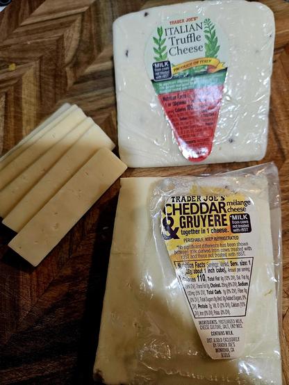 A picture with 2 cheeses from Trader Joes. "Italian Truffle" and "Cheddar & Gruyere."