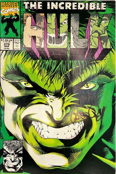 Incredible Hulk #379 (Mar 1991, Peter David – signed) – Dale Keown’s full‑face close‑up of a grinning green Hulk, eyes blazing yellow under shaggy hair; each block‑letter of “HULK” holds a different Hulk visage, with a small black‑and‑white inset headshot at lower left. Peter David’s autograph arcs across Hulk’s lower‑right cheek.