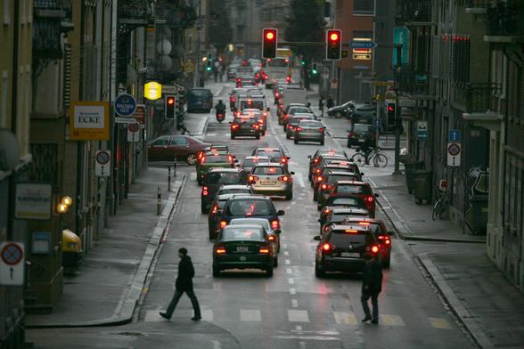 Photo from the article: Weststrasse before, a 2-lane one way street full of traffic.