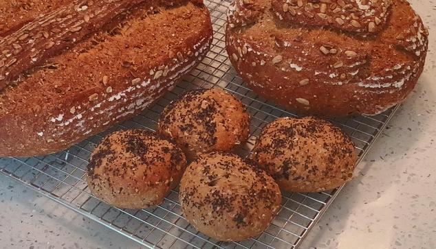 Four little buns asking a batch of sourdough