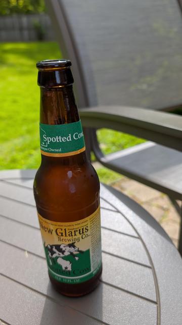 Bottle of Spotted Cow Farmhouse Ale from New Glarus Brewing Company in New Glarus, Wisconsin, USA. 