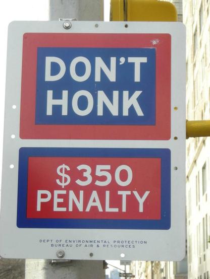 "DON'T HONK $350 PENALTY" sign posted by the New York City Department of Environmental Protection Bureau of Air & Resources