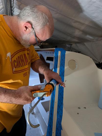 Caulking the starboard hatch rail