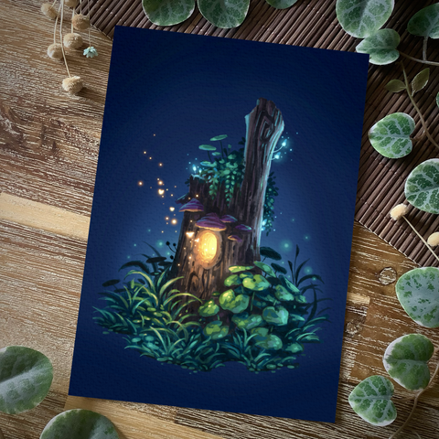 A photo of a print placed on a wooden table and surrounded by plants for decoration. The painting on the print features a tree stump on a dark blue background, a warm glow emanating from a round opening in its front, tiny fairies, mere orbs of light, flying out of it. Lush greenery surrounds the tree stump’s base and grows on its top. Shelf like, purple mushrooms grow above the glowing opening, and tiny, luminescent blue ones on several spots on the bark.