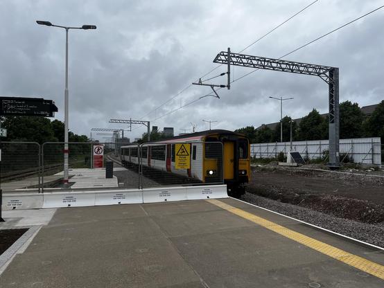 Red and white class 150 train