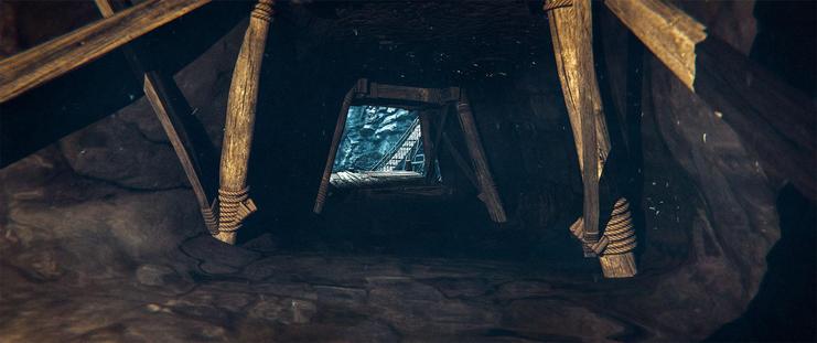 Wide shot, interior, day -

A tunnel with wooden structural supports in the mine.