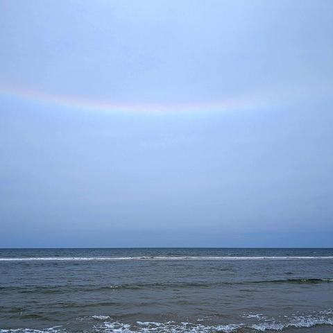 photo of a horizontal rainbow over the Atlantic ocean