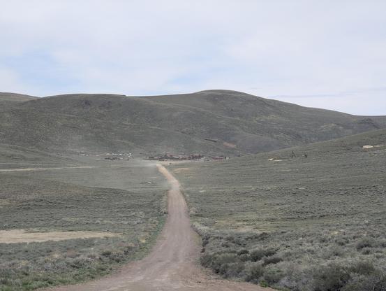Bodie in the distance down a lonesome dirt road in the high desert