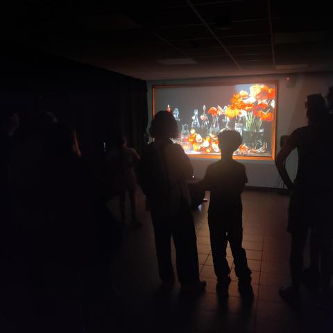 Silhouettes watching an intereactive still life