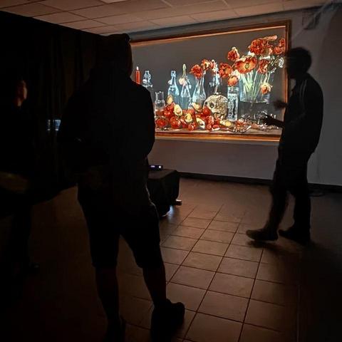 Silhouettes watching an intereactive still life