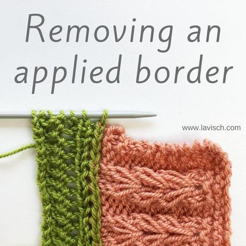 A swatch of a knitting project in pink yarn, with an applied border in green yarn, shown on a gray knitting needle.