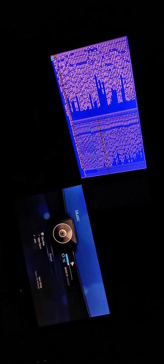 The photograph shot in total darkness, features two distinct elements against a black background. The upper part of the image shows a blue circuit board with white text, resembling a close-up of a microchip or a printed circuit board (PCB). The text is densely packed and organized in rows and columns, with some sections appearing more concentrated than others. The lower part of the image displays a digital music player interface. The screen is dark blue with white text, showing the title "Doo-Bop" by "Miles Davis," with the artist "Sonya" listed below. The interface includes a circular control element, a progress bar, and a time indicator showing "00:09:14" with "00:05:32" next to it. The word "Music" is visible on the right side of the screen.

 Ovis2-8B

🌱 Energy used: 0.220 Wh