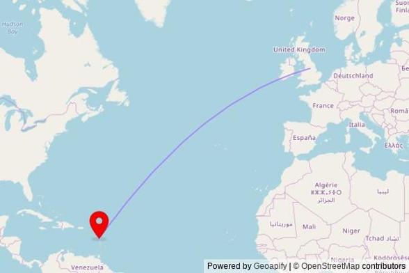 A map showing the great circle route from Barnsley in the United Kingdom to a map pin at St. Alphonsus Church, Winston Lane, Roseau, Dominica