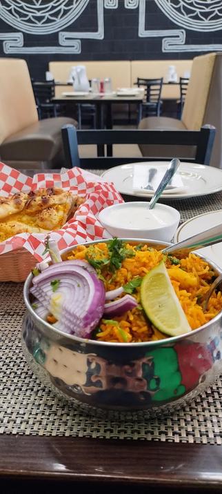 Namaste The Royal Taste Of India, dish of vegetable biryani and garlic naan