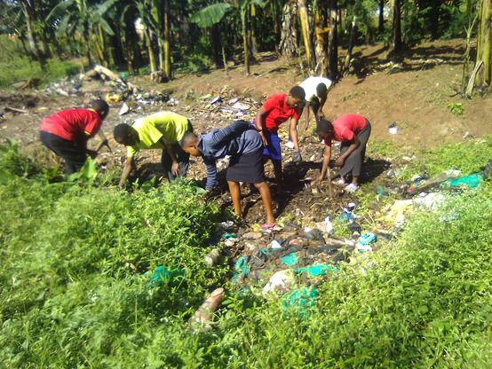 Young farmers picking out polyethylene papers and bottles to conserve the environment 