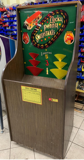 The Lucky Penny Sweepstakes cabinet.

https://www.pinrepair.com/arcade/luckpen.htm