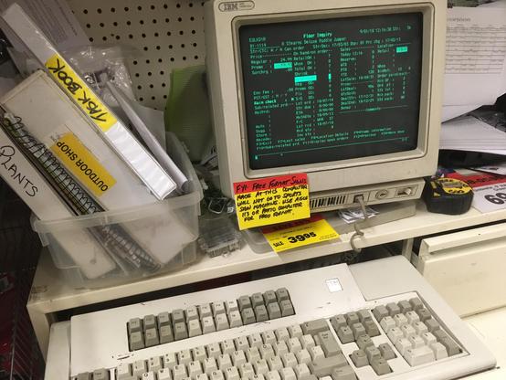 Old IBM terminal with "battleship" keyboard still in use in a Canadian Tire store in 2018.