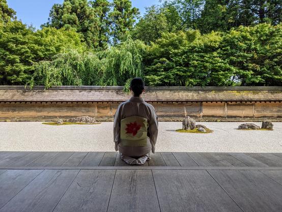 Nao-san contemplates the zen garden at Ryoan-ji.