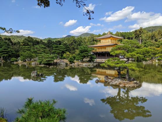Kinkaku-ji under blue skies.