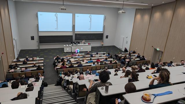 lecture hall with ohs attendees and carson holgate speaking