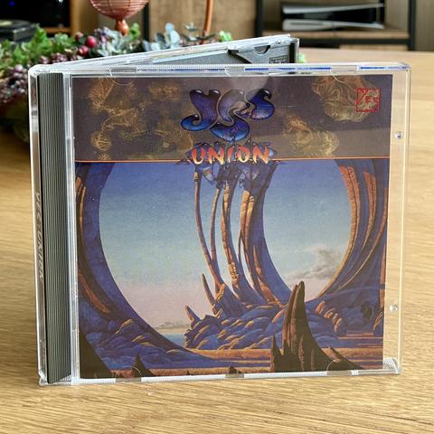 Jewel case of the CD standing open on my  living room table.
