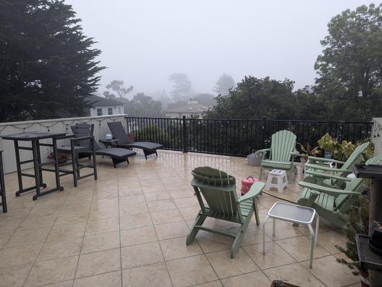 a wet patio under a gray sky
