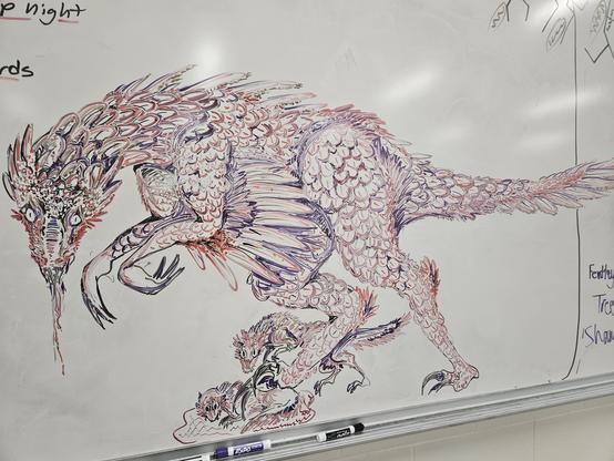 Drawing on a dry erase board of a feathered dragon with two of its offspring.  It is red, purple, and black in color and is looking at the viewer.