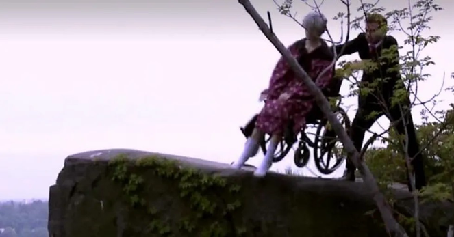 Still from 2012 political ad in which a man in a suit, portraying Republican VP candidate Paul Ryan, pushes granny in a wheelchair off a cliff in yet another GOP attempt to gut Medicare.