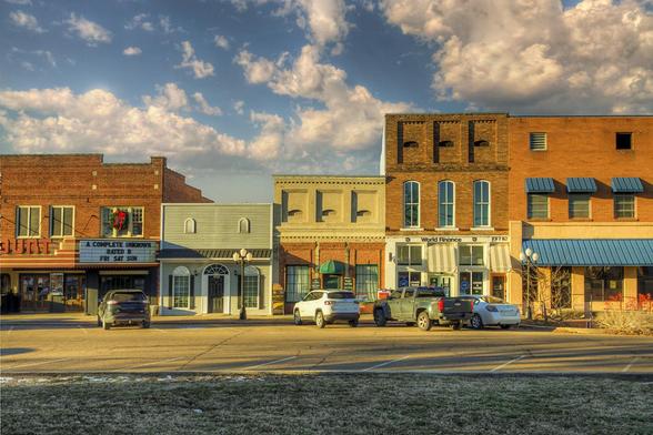 A row of small-town storefronts showcases a variety of architectural styles