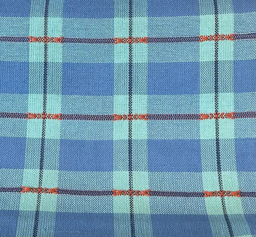 Detail of handwoven blue checked teatowel before wet finishing
