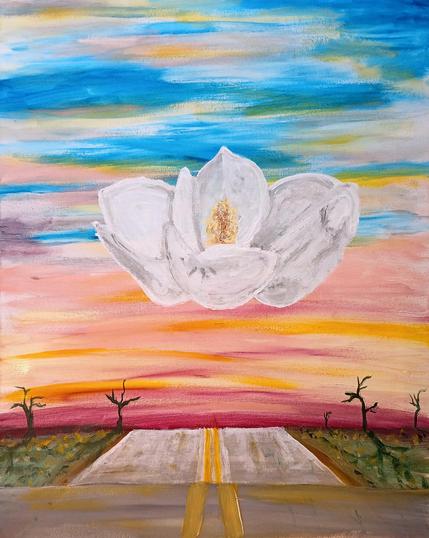 magnolia flower hovering over a road
