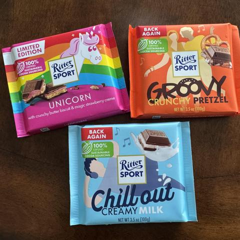 Photo of three colorful 100g bars of chocolate from German manufacturer Ritter Sport:
• Unicorn (crunchy butter biscuit and magic strawberry cream)
• Groovy (crunchy pretzel)
• Chill out (creamy milk)