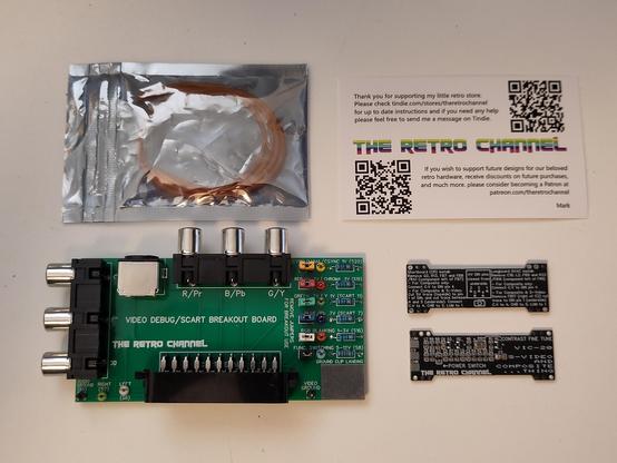 Contents of the package that arrived today. A Video Debug/SCART Breakout board, and two Composite/SVideo Video Enhancement boards for the VIC-20. There's also a "business card", pointing to the Tindie store and the Parteon Page of Mark from TheRetroChannel.