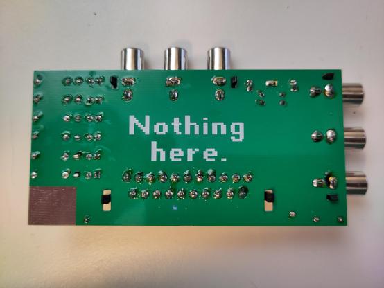 Bottom side of the SCART Breakout board. The only label on it says "Nothing here." with big letters.