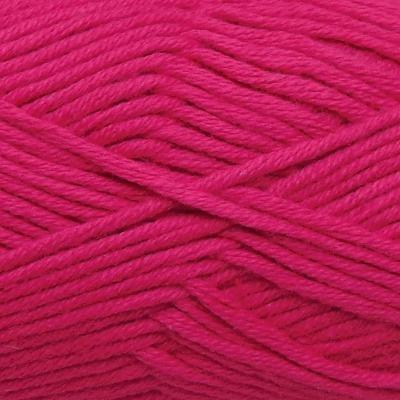 Closeup swatch of cotton yarn, magenta coloured.