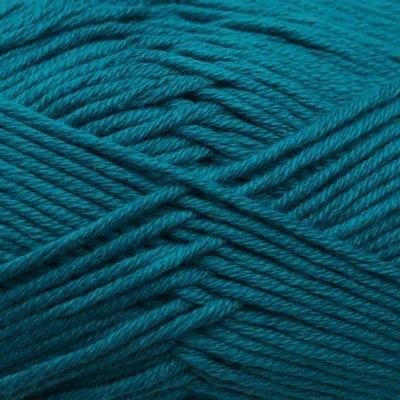 Closeup swatch of cotton yarn, teal coloured.