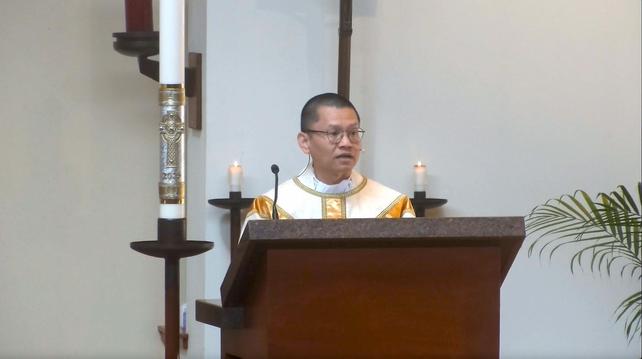 Image of Fr. Anthony preaching at the ambo