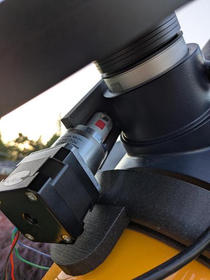 The underside of the motor mount is shown, where the coupler between the motor shaft and the focuser shaft is centered in the frame.