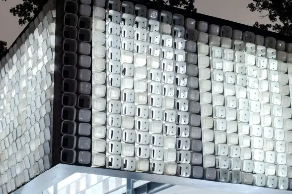 The facade buckets spell out a hidden message in binary code: books are the windows to the world.