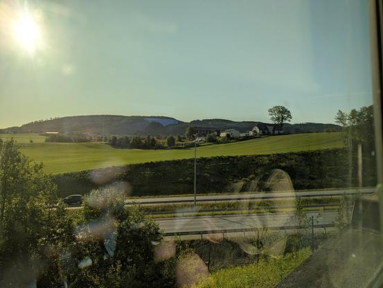 The view is not much to describe. Fields, highway, forest.