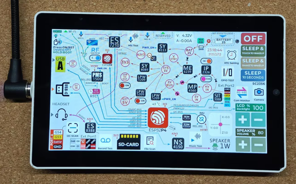 Picture of the M5Stack Tab5 taken from the product page, the Tab5 is connected to an USB cable and laying on a table.