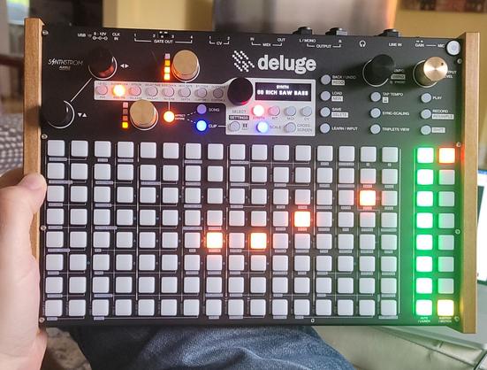 Me holding my brand new Synthstrom Deluge.