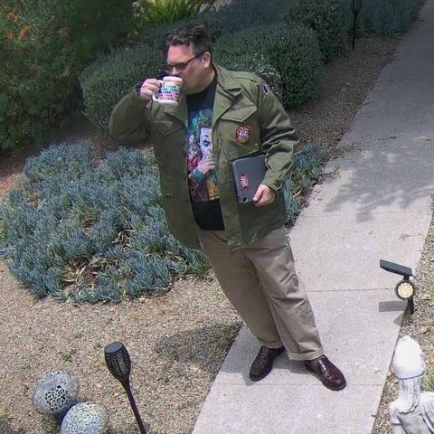 Kyle chugging down some coffee on the walkway 