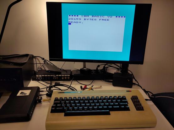 The machine and test setup before the surgery - a very yellowed VC-20 hooked up to a RetroTink 4K Pro, via composite.