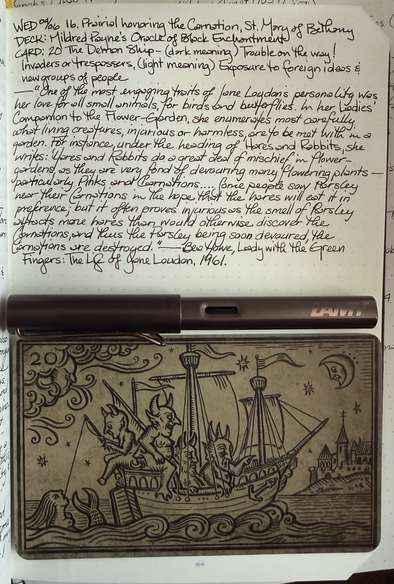 Open notebook with handwritten text from the post at the top of the page with additional text: “One of the most engaging traits of Jane Loudon’s personality was her love for all small animals, for birds and butterflies. In her Ladies’ Companion to the Flower-Garden, she enumerates most carefully what living creatures, injurious or harmless, are to be met with in a garden. For instance, under the heading of Hares and Rabbits, she writes: ‘Hares and Rabbits do a great deal of mischief in flower-gardens, as they are very fond of devouring many flowering plants — particularly Pinks and Carnations. . . . Some people sow Parsley near their Carnations in the hope that the hares will eat it in preference; but it often proves injurious as the smell of Parsley attracts more hares than would otherwise discover the Carnations, and thus the Parsley being soon devoured, the Carnations are destroyed.’” — Bea Howe, Lady with the Green Fingers: The Life of Jane Loudon, 1961. Below the text a brown fountain pen with a copper clip lies across the page with a large, landscape-formatted card beneath it. The card has a wood-cut style image of four devils in a wooden mast ship being blown by anthropomorphic wind toward a peaceful looking seaside town under a beaming moon. One of the devils is fishing and has caught a mermaid on his line.