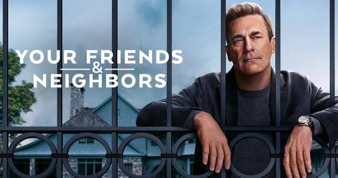 The title card for the Apple TV+ show „Your Friends & Neighbors“. Jon Hamm is leaned against a metal fence with his hands reaching through like he‘s behind bars in a prison. You can see his house in the background.