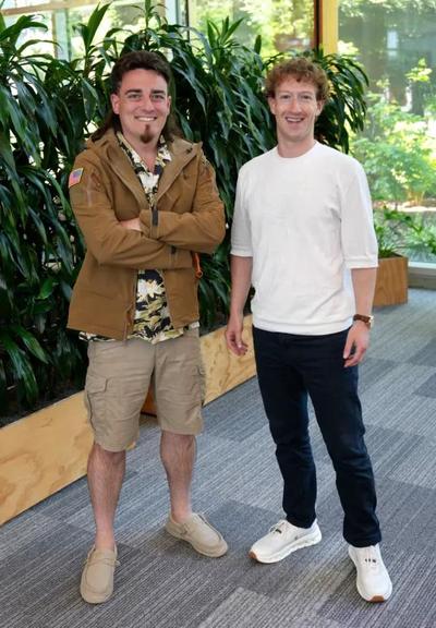 Mulleted mercenary Palmer Luckey and hotornot ripoff scumbag Mark Zuckerberg, standing together looking like the least normal humans
